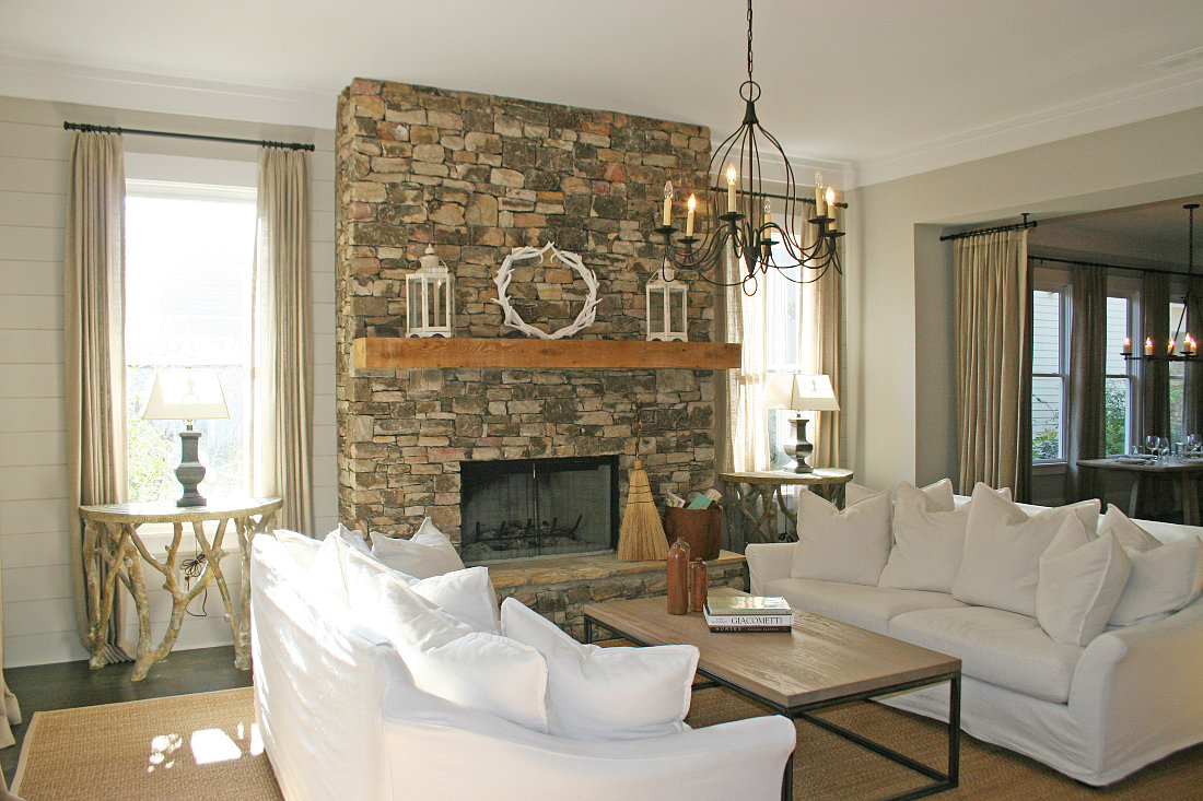 decoration-stacked-stone-fireplace-in-the-modern-living-room-with-white-sofa-set-and-chandelier-and-wooden-flooring-and-white-color-of-wall-and-ceiling-paint-build-a-country-stacked-dry-stone-fireplace-s